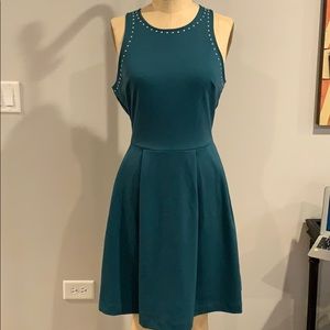 Dress with studs around neck